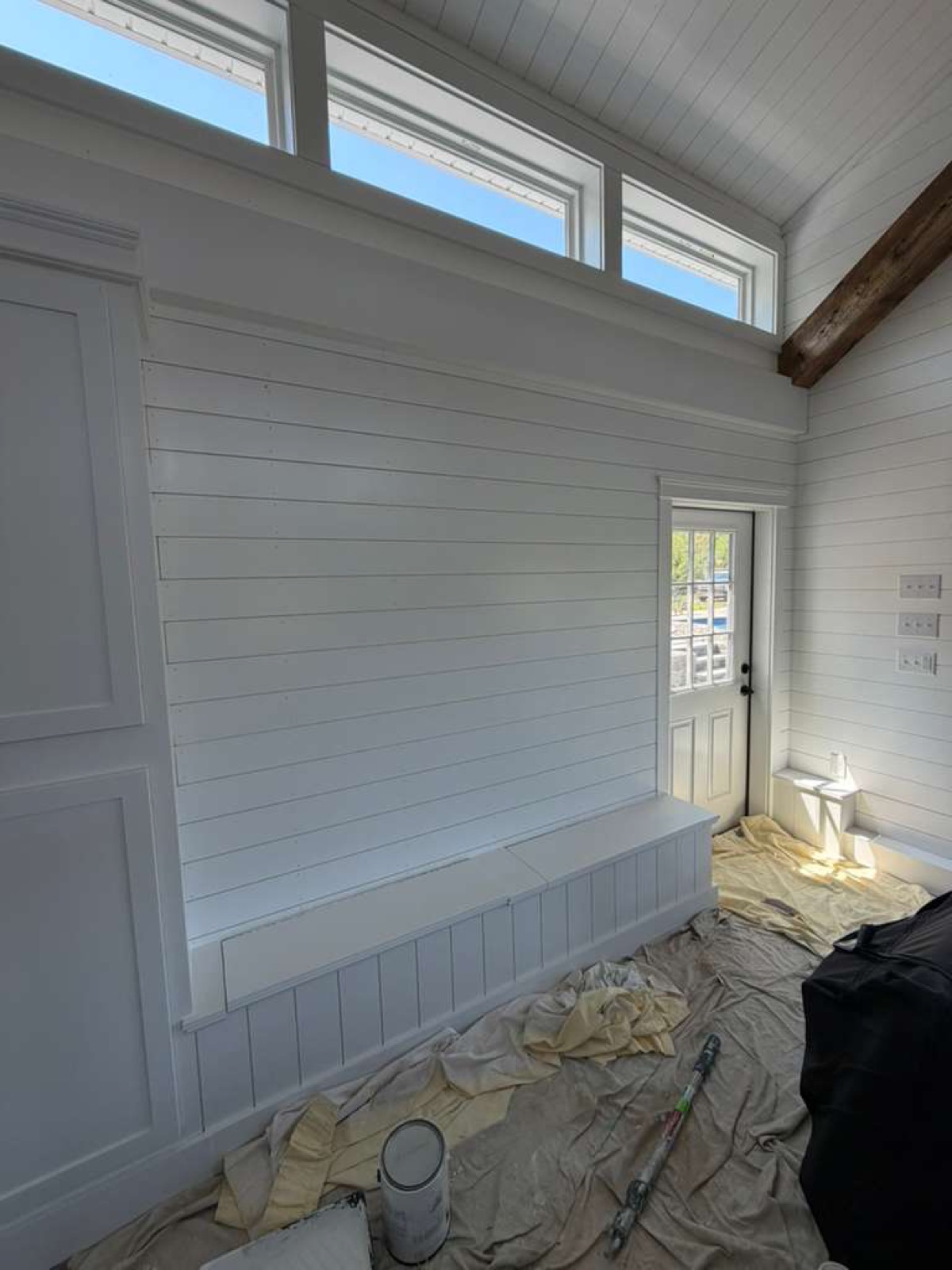 Fresh white shiplap interior wall and trim painting