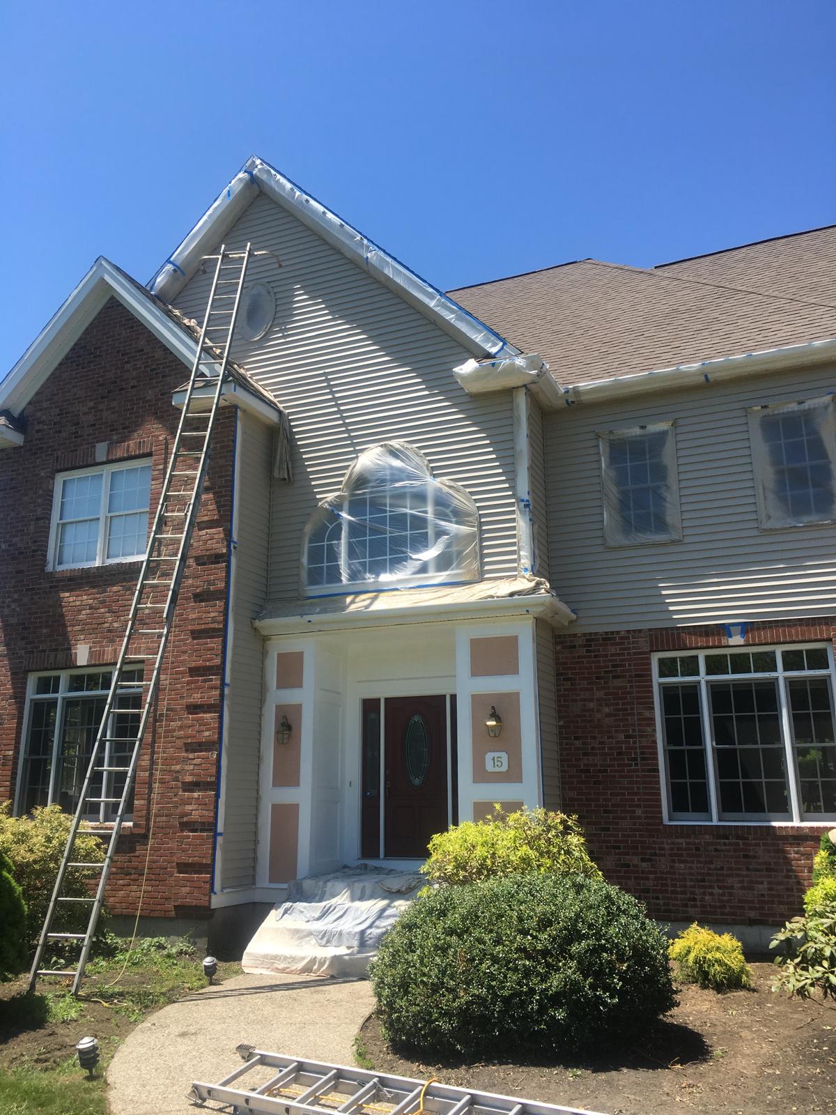 Exterior home masked and prepped for painting
